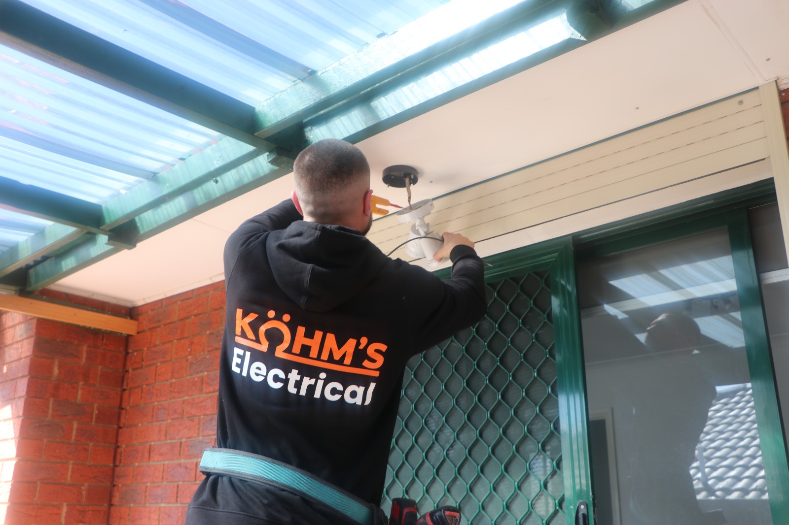 Kohm's Electrical completing an outdoor lighting installation