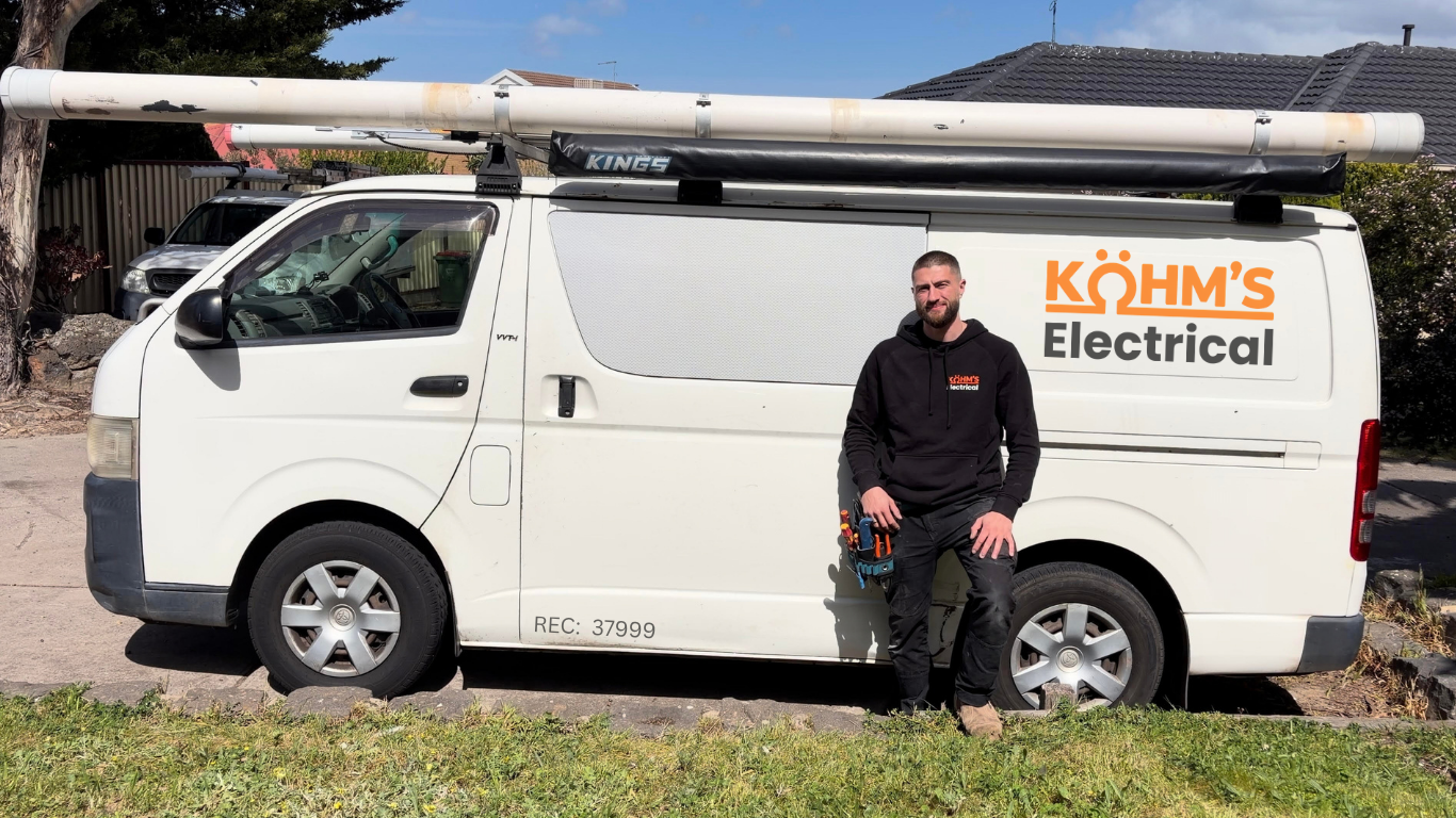 Kohm's Electrical electrician beside the service van in Melbourne